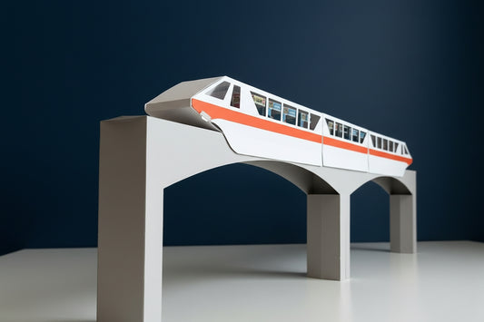 Model train on a miniature bridge with a brown background